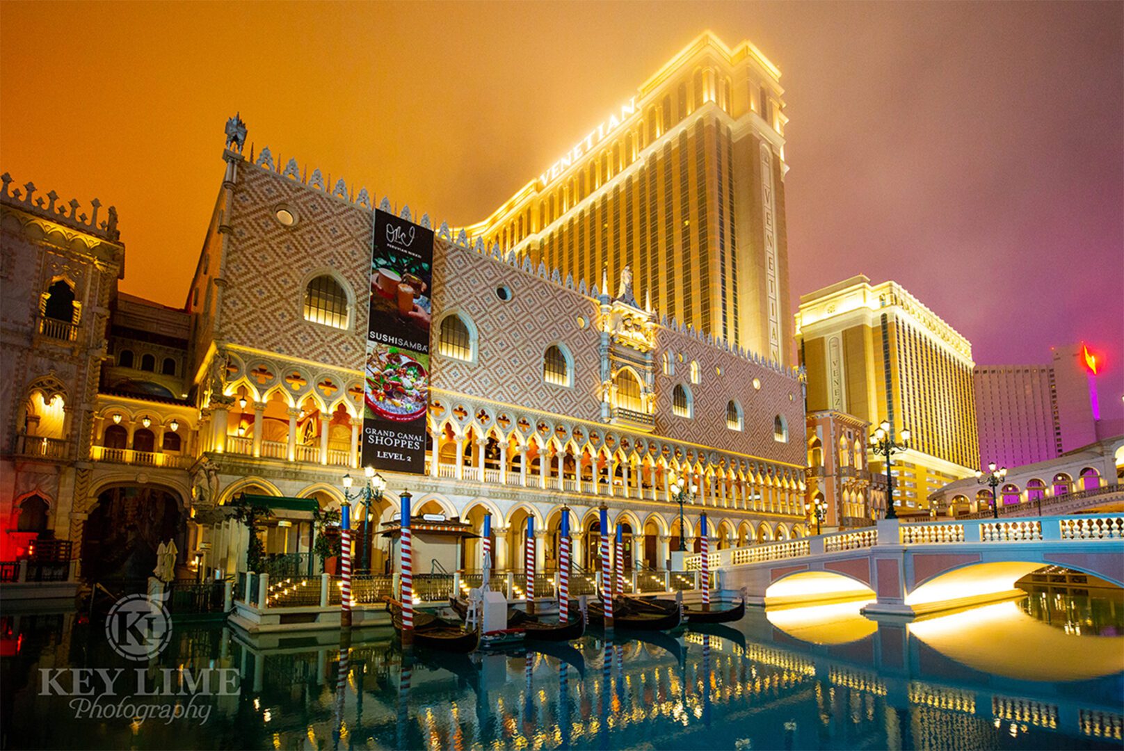 Colonnade architecture photographer image. Dreamlike resort hotel. Pink and orange clouds overhead.