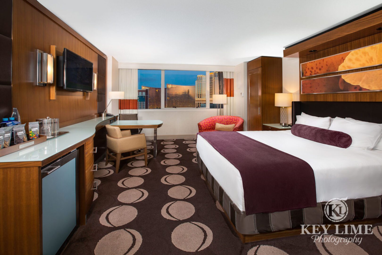 Resort hotel suite. Architectural photographer image of room with TV and a single king size bed.