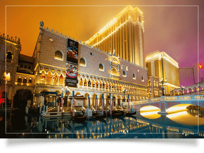 Las Vegas photographer image of the colonnade at Doge's Palace architecture. Bright and vibrant yellow, teal and pink hues. Majestic lighting with low clouds