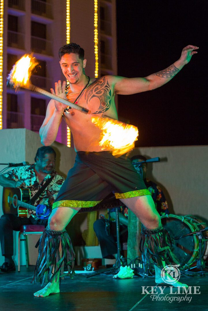 Rooftop party photos of luau at plaza hotel. fire juggler