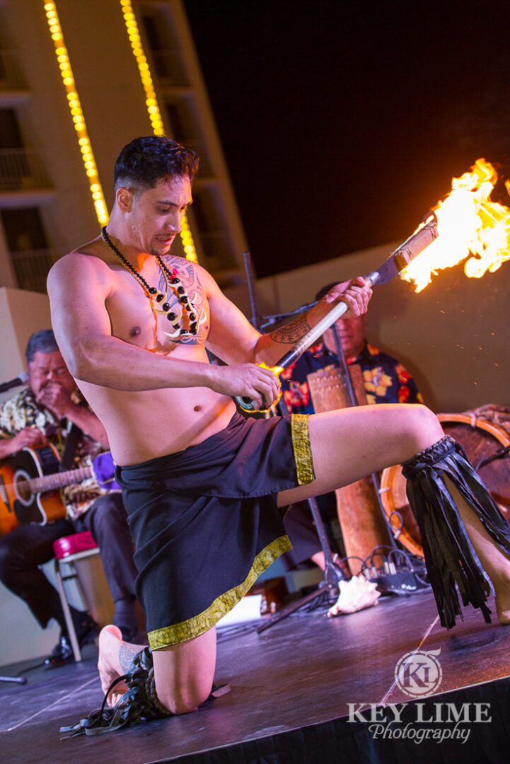 Rooftop party photos of luau at plaza hotel. fire juggler