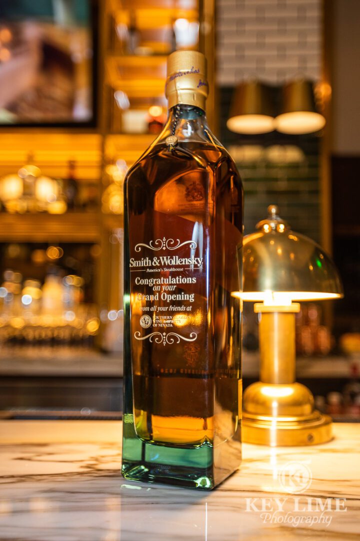 Whisky bottle on bar top.