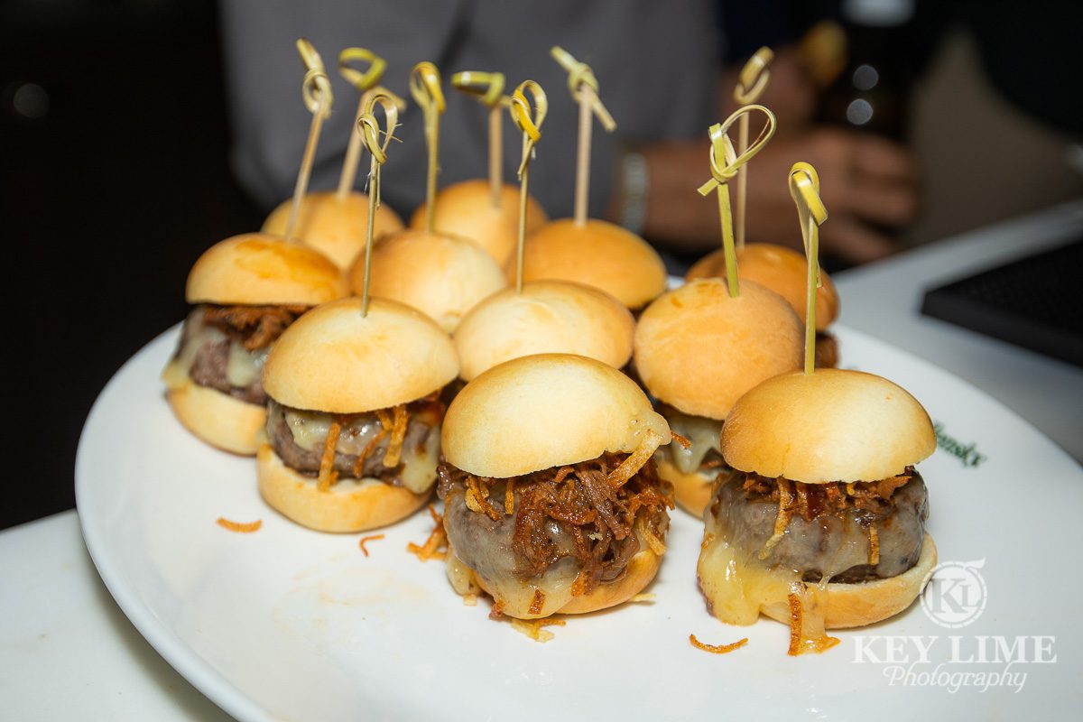 Appetizer sliders on a white serving plate