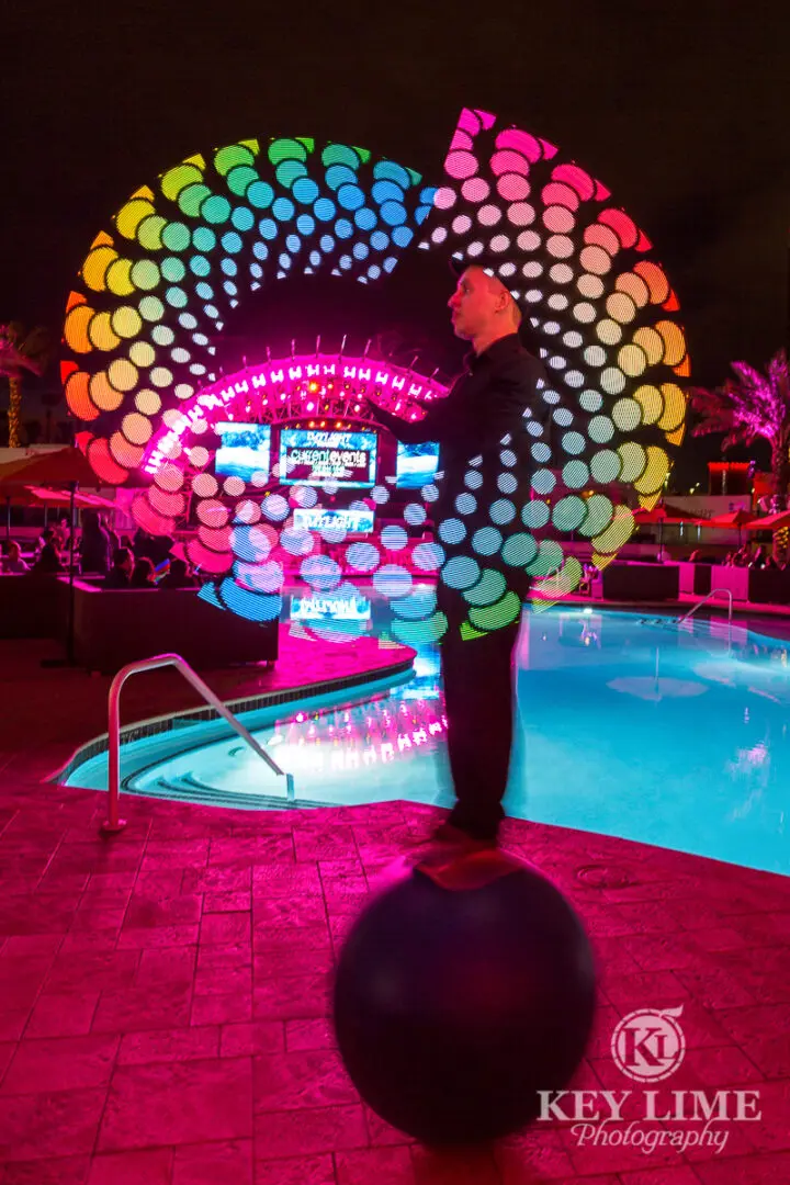 Unique event performer in Las Vegas. LED sign spinner on a balancing ball.