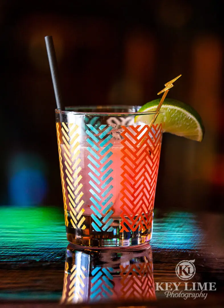 Fun, colorful cocktail with lightening bolt stir stick.