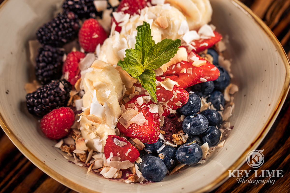 Food photographer in Las Vegas. Image of healthy breakfast. Raspberries, blueberries, strawberries, bananas and oatmeal